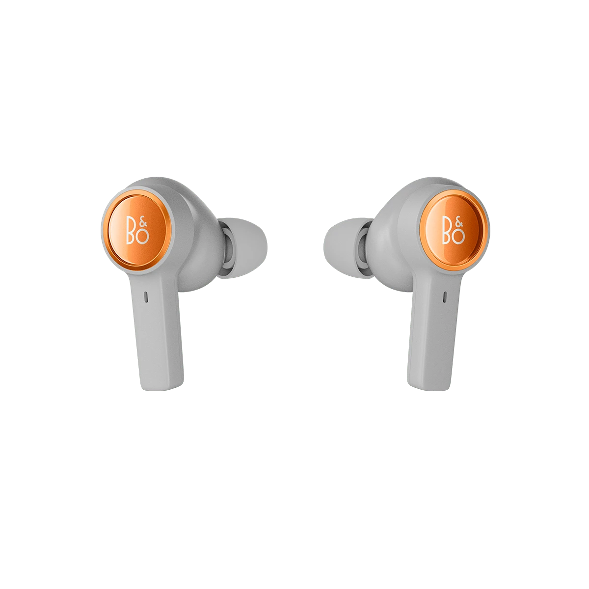 Beoplay Eleven earbuds in COpper tone slightly tilted and displays the B&O logo