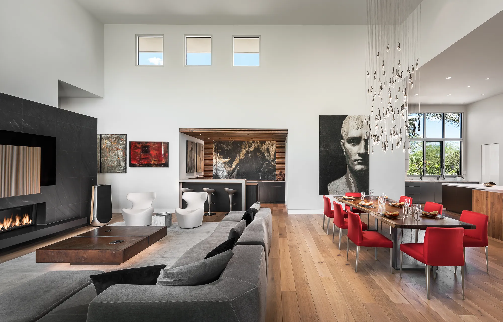 Great room toward the bar with edge-lit floating table and layered scene lighting